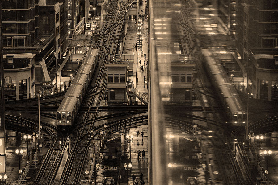 An aerial shot of downtown Chicago and the above-ground L-train.